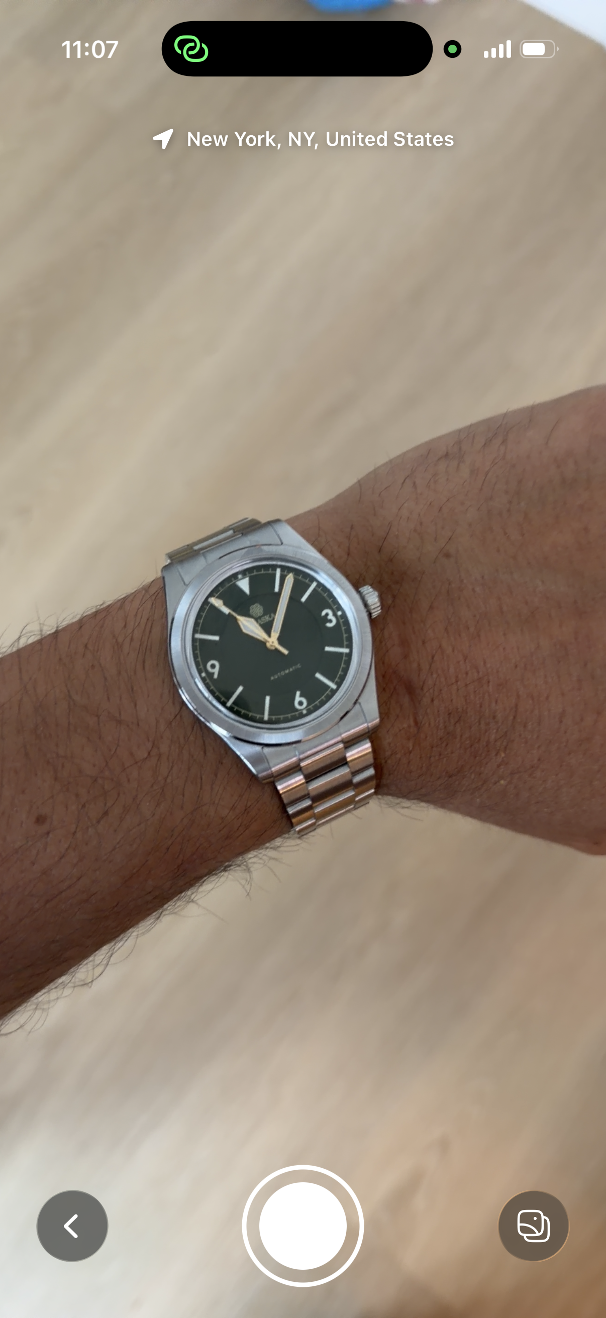 Loupe camera screen identifying a watch